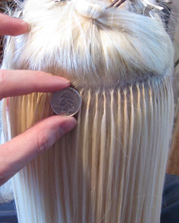 The color of the bond is also matched in color to the hair, so it is nearly invisible.